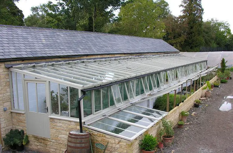 I LOVE these cold frames against the lean to greenhouse