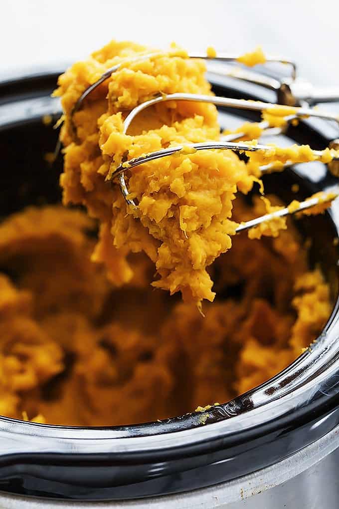 Mashed sweet potatoes in a slow cooker #crockpot #sidedishes #crockpotholidays #slowcooker #slowcookersidedishes #thanksgiving #christmasdinner #slowcookerchristmas #slowcookerthanksgiving #crockpotrecipes