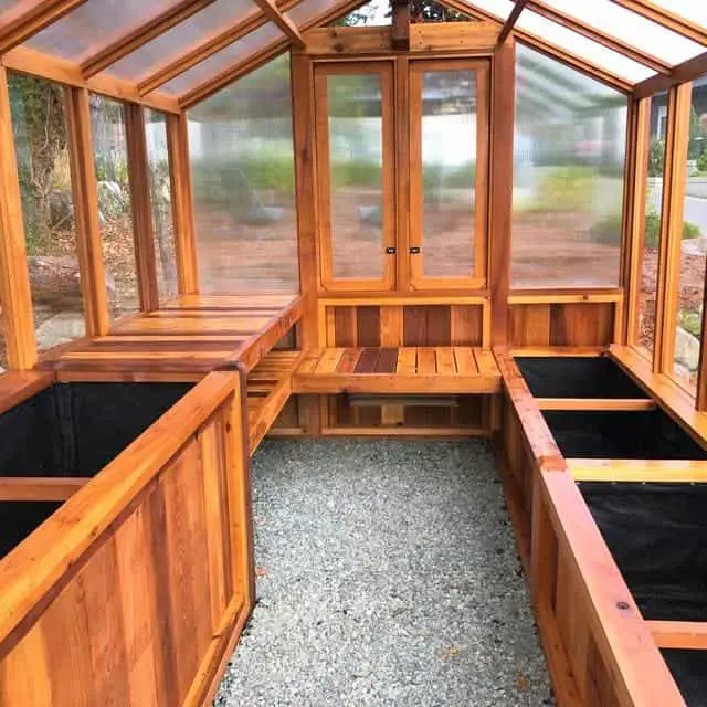 Greenhouse benches in a cedar wooden greenhouse